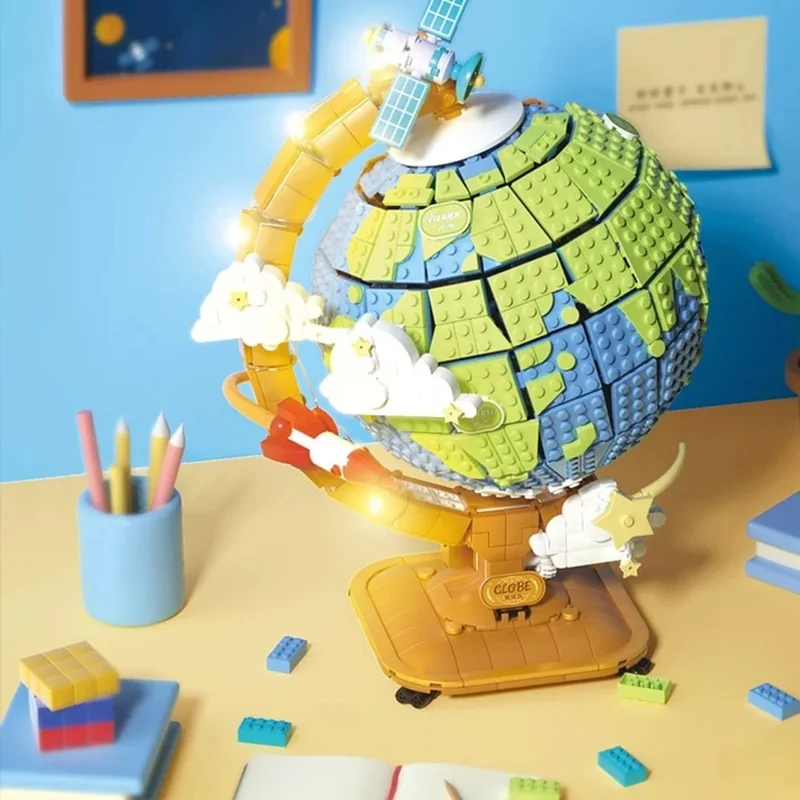 نمای روبرو از لگو کره زمین آموزشی بر روی میز مطالعه
